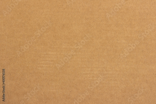 The surface structure of light brown cardboard.
