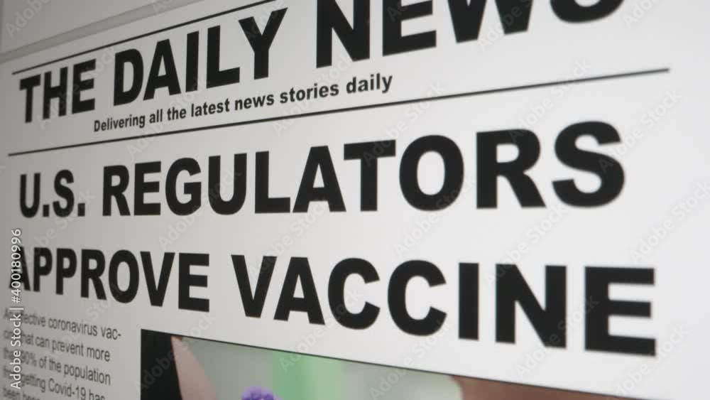Extreme Close Up Shot of Coronavirus Vaccine News Article Scrolling On Computer Screen Extreme Close Up Shot of Coronavirus Vaccine News Article Scrolling On Computer Screen