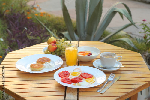 Breakfast with scrambled eggs, fruit and orange juice