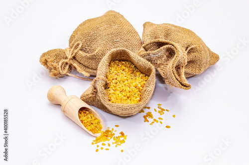 Bulgur grains isolated on white background