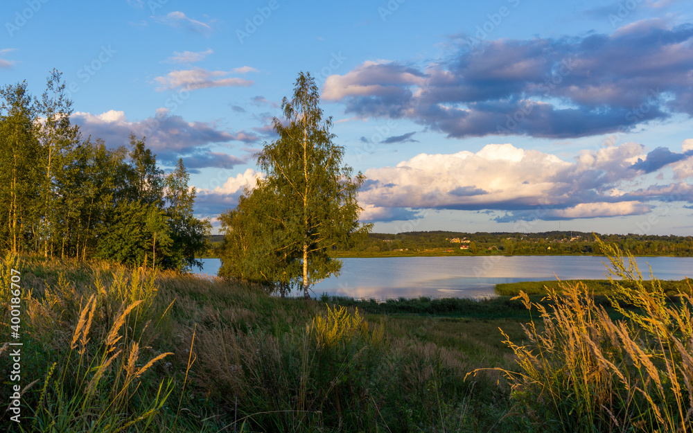 Summer landscape with cloudy sky.