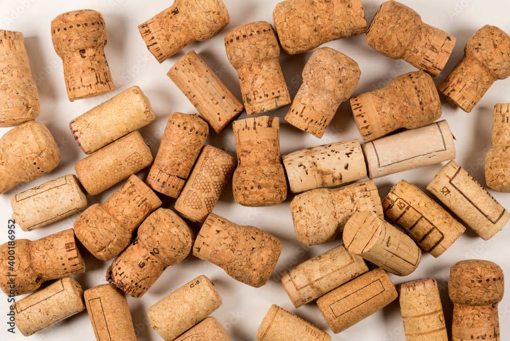 used wine corks scattered randomly on white background with top view, close up overhead view