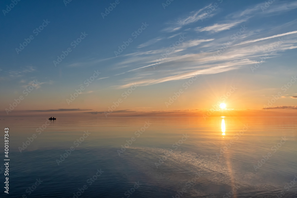 Sunset on the lake in summer, Pskov region
