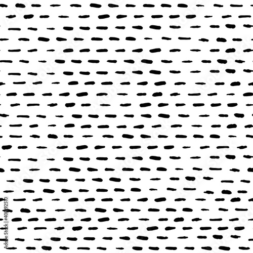 Hand drawn dashed line vector seamless pattern. Black brush strokes. Monochrome hand drawn stripes. 