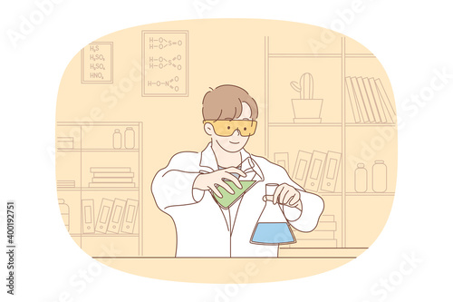 Science, chemistry, experiment concept. Young smiling boy scholar medical lab worker making chemical reaction in laboratory. Scientific test academic research, school experiments 