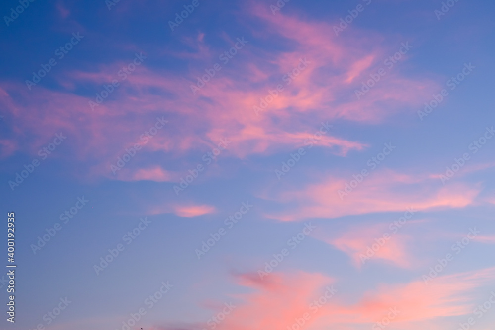 Orange purple clouds with blue sky in twilight evening time.