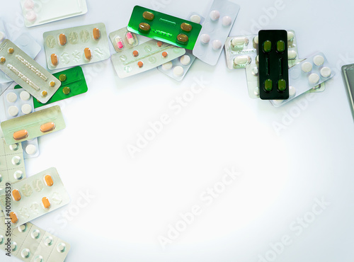 Lot of pharmaceutical pills medicine from above in white background