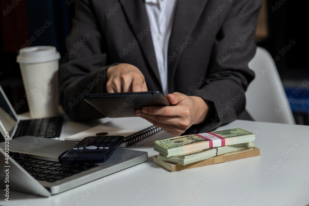 business hands working on digital smartphone and laptop computer at table office. business technology and financial advisor and accounting concept. business hands working on digital smartphone and laptop computer at table office. business technology and financial advisor and accounting concept.