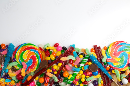 Multicolored assortment of candies. Background of sweets and lollipops and colorful array of different treats 