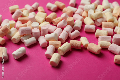 Sweet marshmallow on pink background, close up