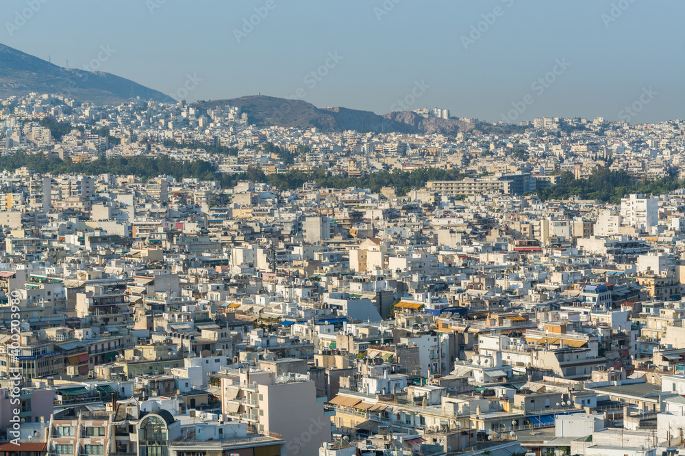 Aerial view of cityscape with crowded buildings of Athens in a sunny day in Greece