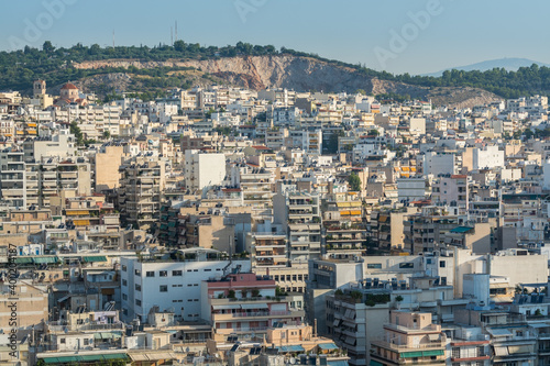 Fototapeta Naklejka Na Ścianę i Meble -  Aerial view of cityscape with crowded buildings of Athens in a sunny day in Greece
