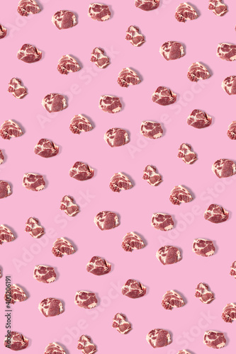 background with raw pork meat slices on pink background, raw food background, not pattern, poster modern creative, flatlay