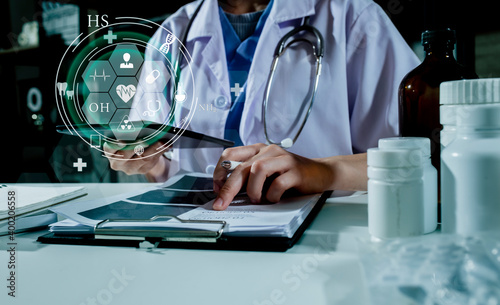 Medical technology and futuristic concept. Doctor using hologram modern virtual screen interface icons. 