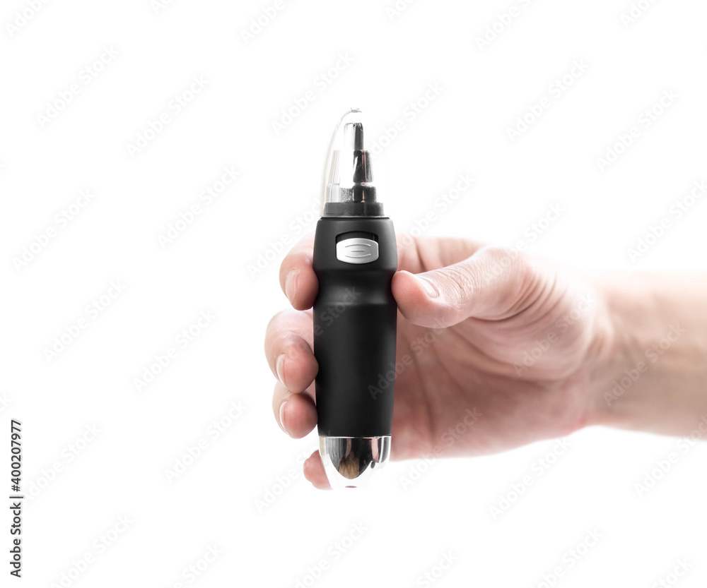 Hand holding a black nose trimmer. Close up. Isolated on a white background Hand holding a black nose trimmer. Close up. Isolated on a white background