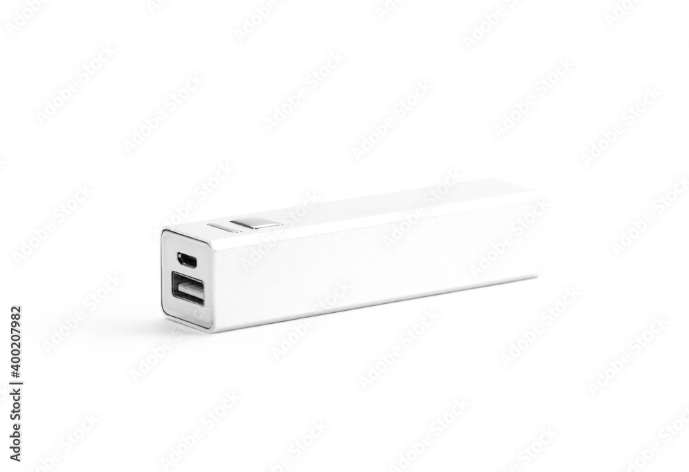 A small silver metal power bank. Close up. Isolated on a white background A small silver metal power bank. Close up. Isolated on a white background