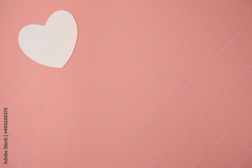 Paper hearts over the pink pastel background. Abstract background with paper cut shapes. Saint Valentine, mother's day, birthday greeting cards, invitation, celebration concept