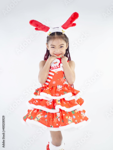 Merry Christmas girl Wearing Santa claus suit on white background
