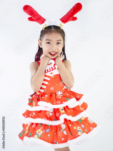 Merry Christmas girl Wearing Santa claus suit on white background