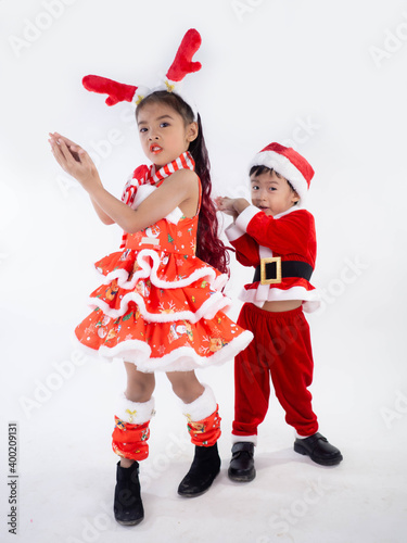 Merry Christmas girl Wearing Santa claus suit Dancing baby shark on white background