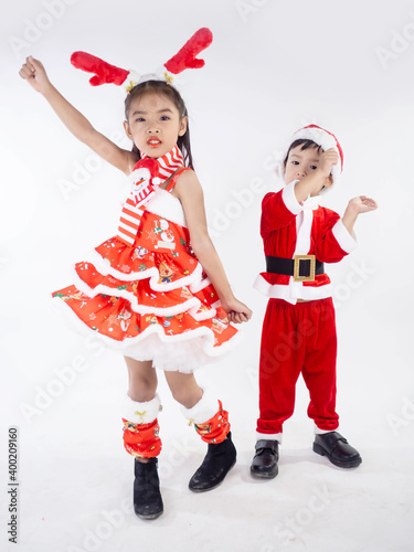 Merry Christmas girl Wearing Santa claus suit Dancing baby shark on white background