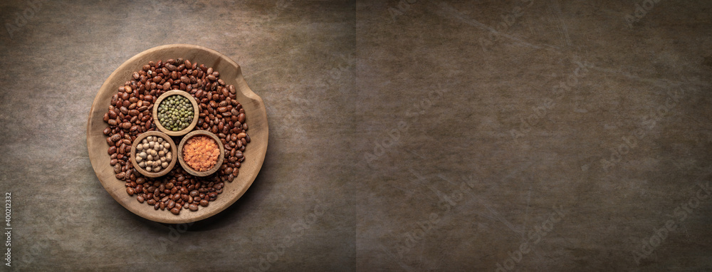 Bowl of various dried legumes. Food background. Overhead shot with copy space.