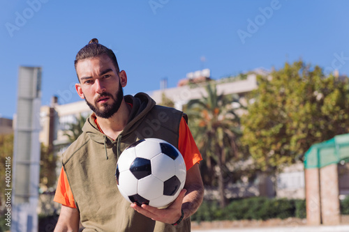 attractive soccer player with a ball in his hand © Raul Mellado