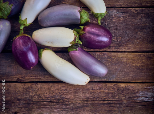 Organic eggplant on a wooden background.