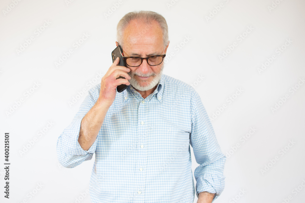 Portrait of happy european senior man talking on phone over white background. Portrait of happy european senior man talking on phone over white background.