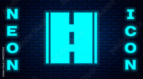 Glowing neon Road icon isolated on brick wall background. Vector.