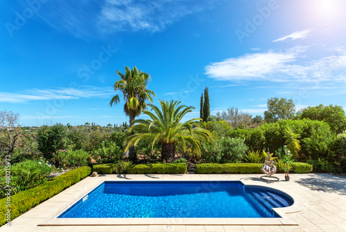 Luxury swimming pool with sun loungers. For relaxation and swimming. 