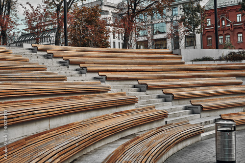 Murais de parede Wooden benches in the city in the form of an amphitheater