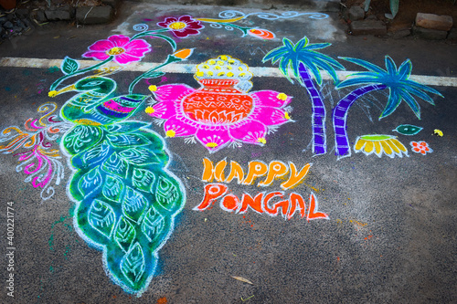 beautiful colorful Rangoli muggulu designs with colours in India during pongal sankranthi festival and in all hindu festivals in fronts of their houses and temples photo