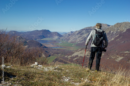hiker in the mountains with lake in matese park