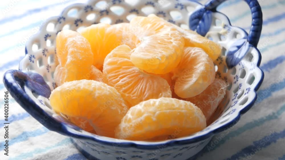 close up of slice of orange fruit in a bowl close up of slice of orange fruit in a bowl