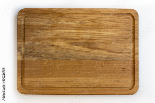 Used wooden chopping board isolated on white background.