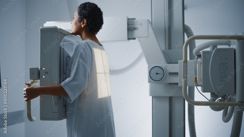 Hospital Radiology Room Beautiful Latin Woman Standing Next to XRay