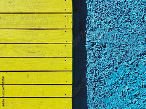 
Texture of the painted wall yellow with blue