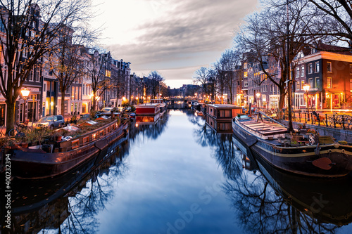 Amsterdam canals in the evening light, Dutch canals in Amsterdam Holland Netherlands during winter time in the Netherlands. Europe photo