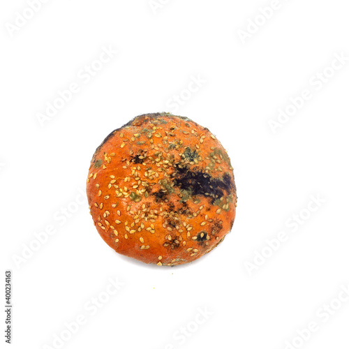 Фотография Coal black moldy bun for a Burger isolated on white background.