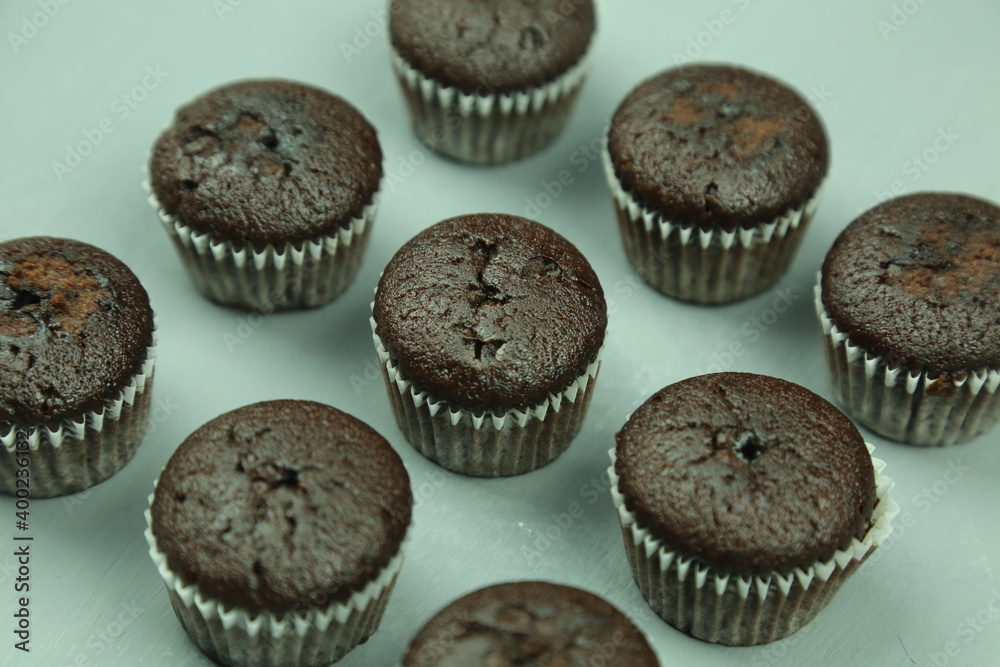 Chocolate cupcakes with colored background