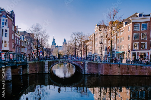 Amsterdam canals in the evening light, Dutch canals in Amsterdam Holland Netherlands during winter time in the Netherlands. Europe photo