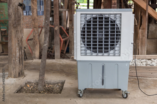 Evaporative Air Cooling Fan. Air conditioning. portable air cooler and humidifier on casters. Mobile air purifier.  photo