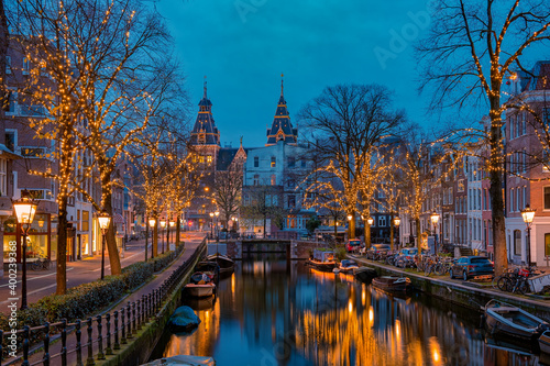 Amsterdam Netherlands canals with Christmas lights during December, canal historical center of Amsterdam at night. Europe