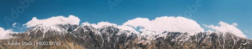 Mtskheta-Mtianeti Region  Georgia. Panorama Of Mountain Peaks. Blue Sunny Sky Over Varied Mountains Landscape In Kazbegi District. Sunny Blue Sky