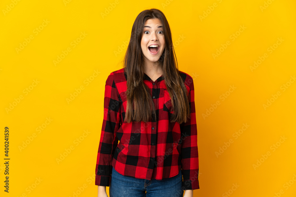 Teenager Brazilian girl isolated on yellow background with surprise facial expression Teenager Brazilian girl isolated on yellow background with surprise facial expression