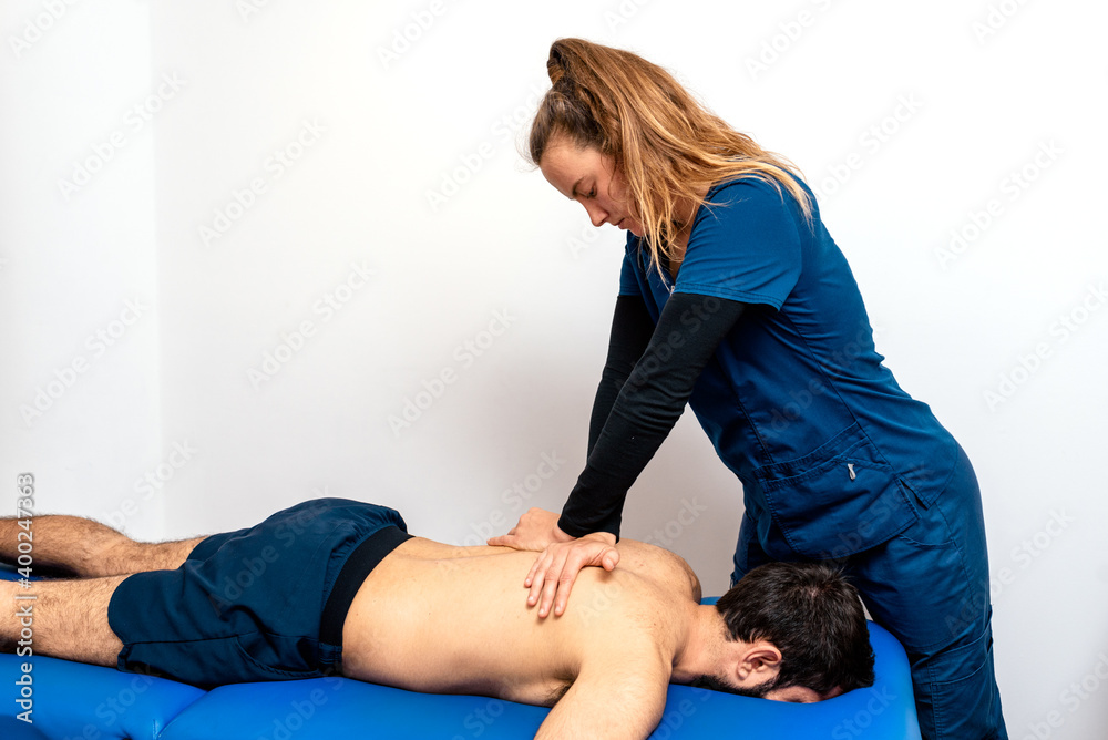 Masseuse Twisting back Of Patient Masseuse Twisting back Of Patient