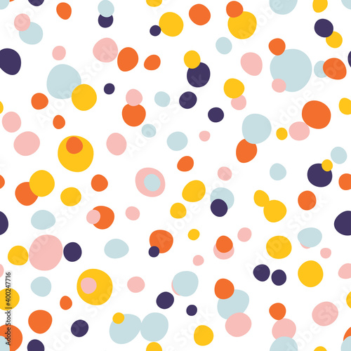 Fototapeta Naklejka Na Ścianę i Meble -  Seamless abstract pattern of colored dots. Bright, colorful confetti.