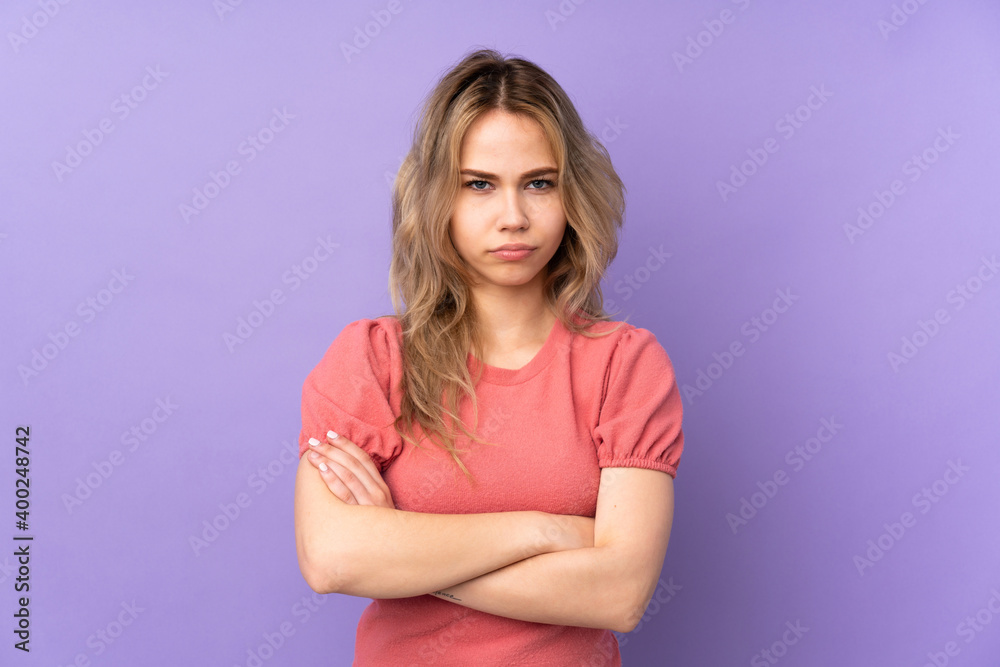 Teenager Russian girl isolated on purple background feeling upset Teenager Russian girl isolated on purple background feeling upset