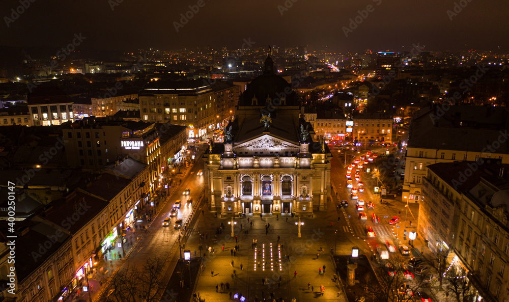 Fototapeta premium Aerial view on Lviv Opera at night from drone